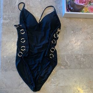 Black Swimsuit With Gold Rings On The Side